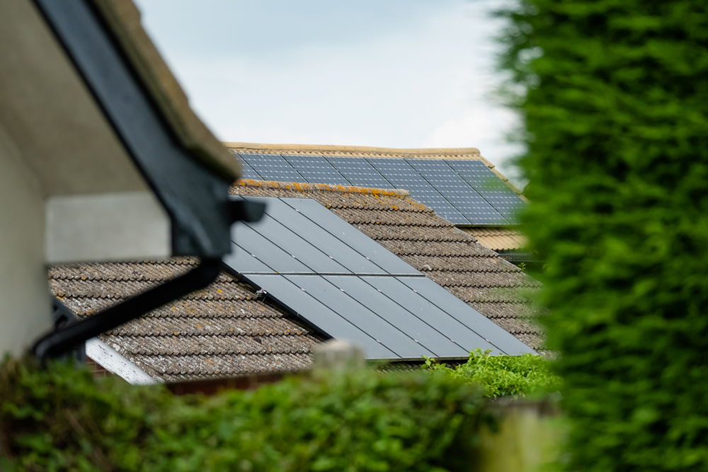 Solar panels installed on a house roof, leading to energy savings