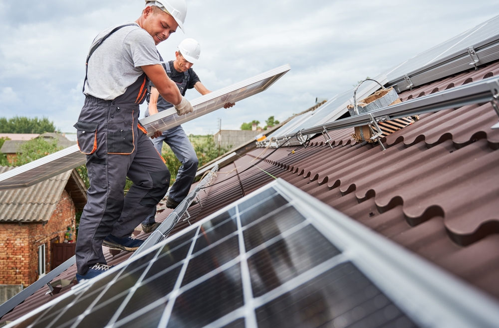 Workers Ensure Good Solar Panel Efficiency